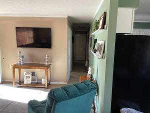 Before view of the kitchen and living room space. 