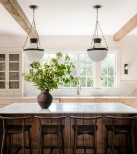 warm white kitchen with black, brass, and polished nickel accents. 